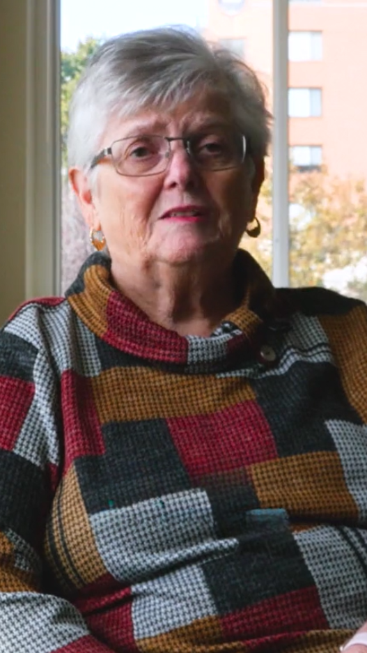 Senior woman in checkered sweater